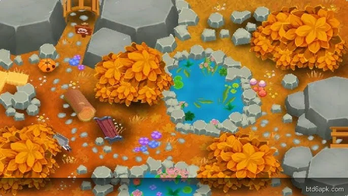 Bloons TD 6 autumn spiral map gameplay showing various monkey towers defending against bloons